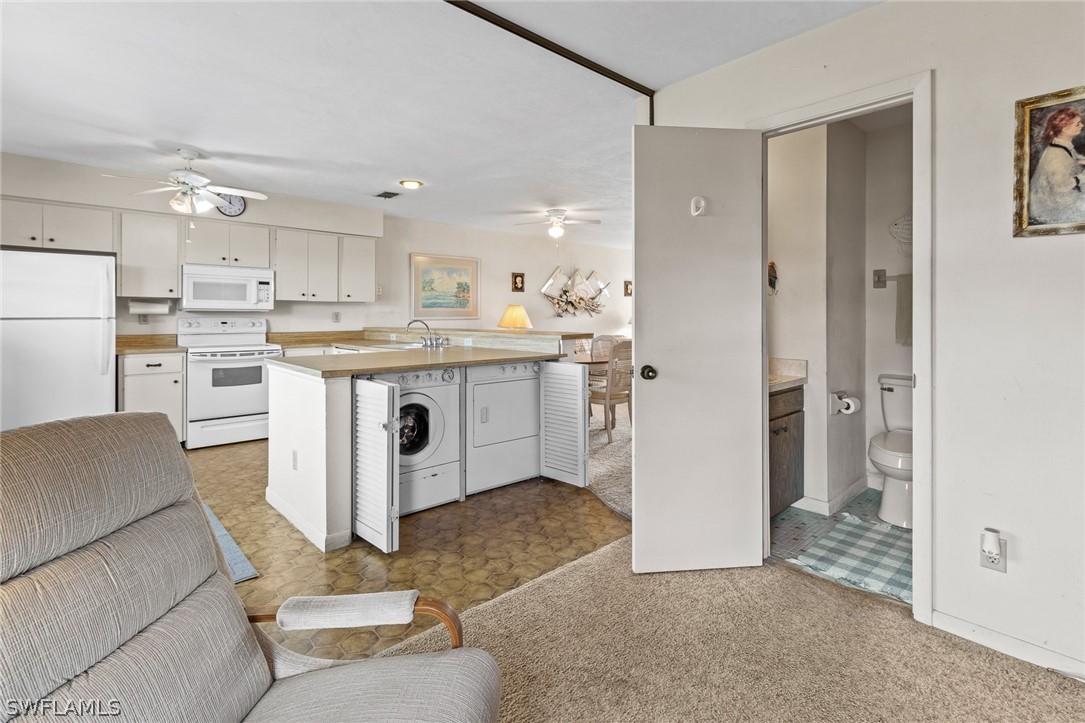 1609 Ridgecrest Street Lehigh Acres, FL 33936 - Photo 8 of 20 a view of kitchen with furniture and refrigerator