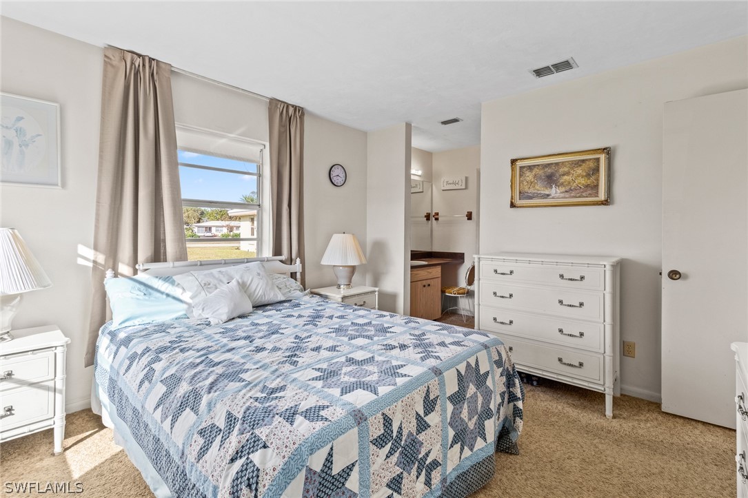1609 Ridgecrest Street Lehigh Acres, FL 33936 - Photo 9 of 20 a bedroom with a bed and a window