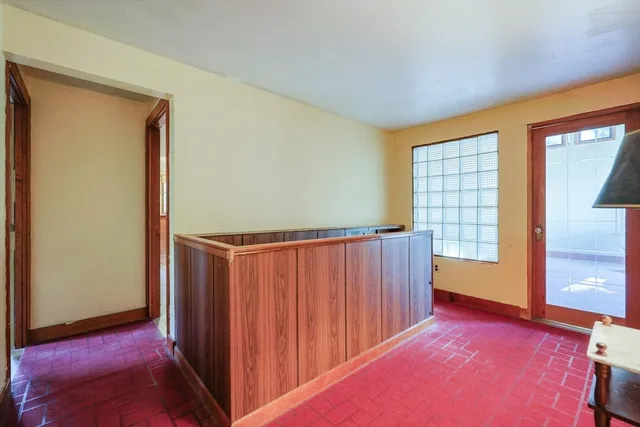 a view of a room with a large window