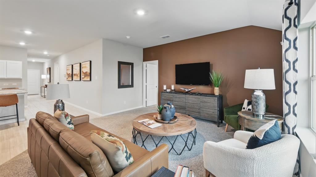 1505 Cansler Drive Krum, TX 76249 - Photo 11 of 39 a living room with furniture and a flat screen tv
