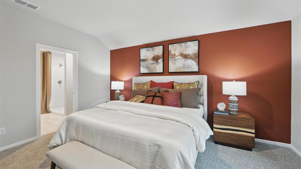 1505 Cansler Drive Krum, TX 76249 - Photo 15 of 39 a bedroom with a bed and a large window