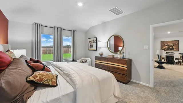 a bedroom with a bed and a couch