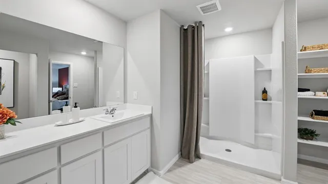 a bed room with bed and a large window