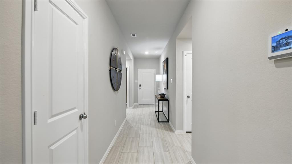 1505 Cansler Drive Krum, TX 76249 - Photo 22 of 39 a view of a room with wooden floor and bathroom