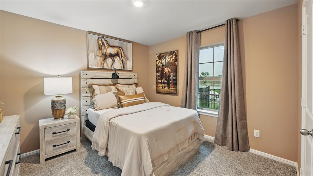 1505 Cansler Drive Krum, TX 76249 - Photo 29 of 39 a bedroom with a bed and a window