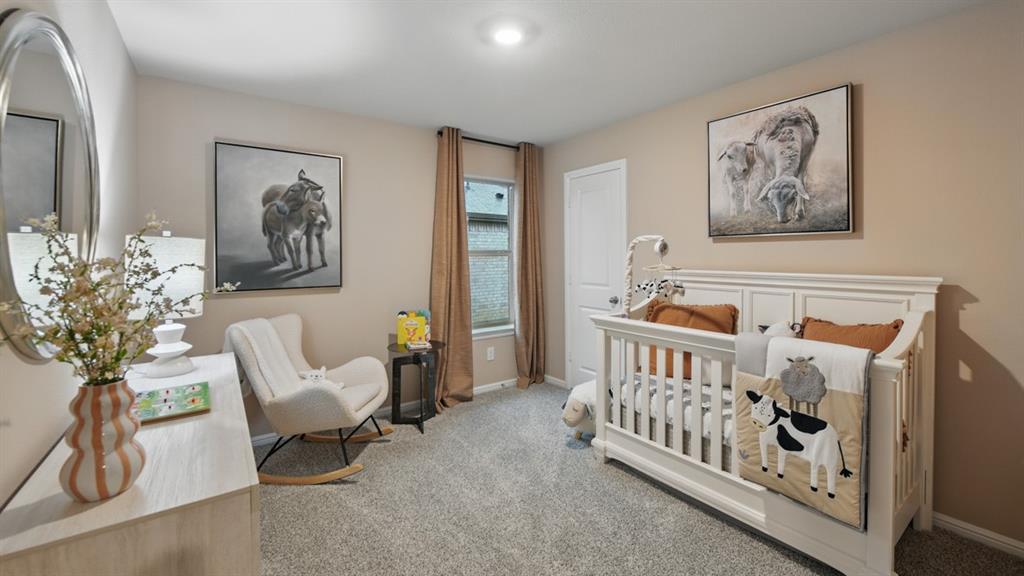 1505 Cansler Drive Krum, TX 76249 - Photo 33 of 39 a bedroom with furniture and a window