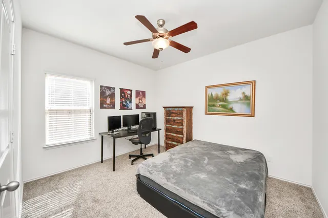 a work room with furniture and windows