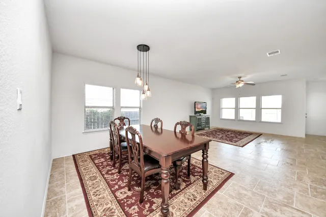 a view of a livingroom with furniture and window