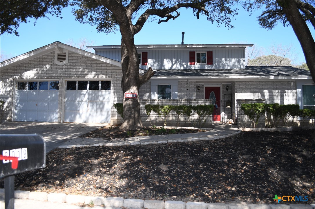 6019 Forest Ridge San Antonio, TX 78240 - Photo 1 of 25 a front view of a house with a yard