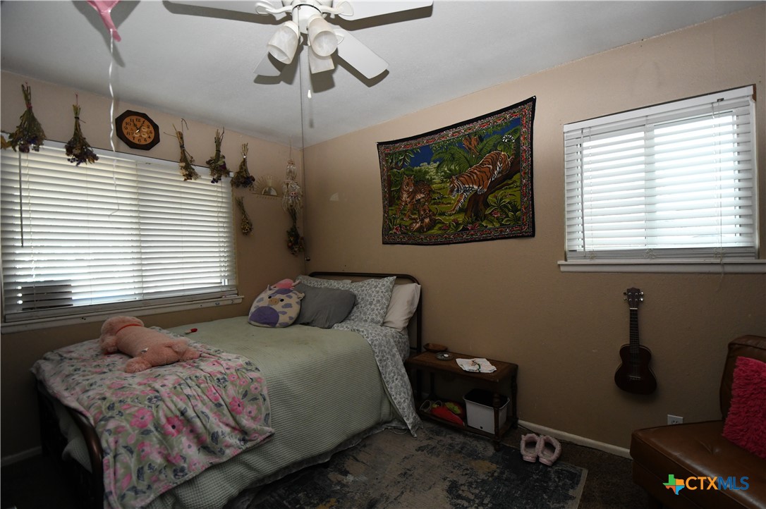 6019 Forest Ridge San Antonio, TX 78240 - Photo 11 of 25 a bedroom with a bed and window