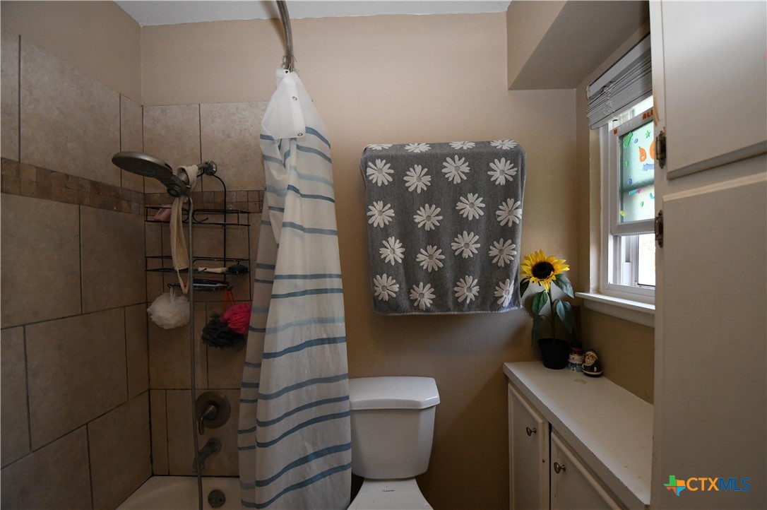 6019 Forest Ridge San Antonio, TX 78240 - Photo 13 of 25 a bathroom with a toilet and a shower