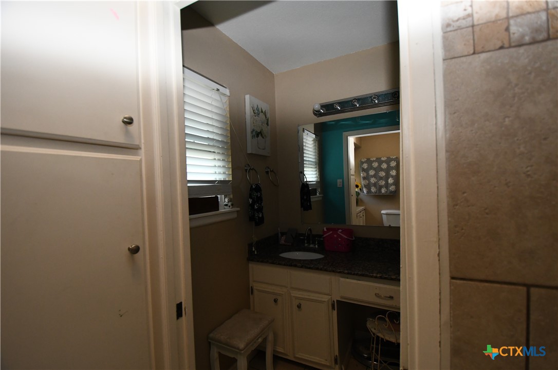 6019 Forest Ridge San Antonio, TX 78240 - Photo 14 of 25 a kitchen with a sink and cabinets