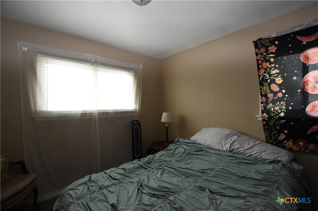 6019 Forest Ridge San Antonio, TX 78240 - Photo 15 of 25 a bedroom with a bed and a window