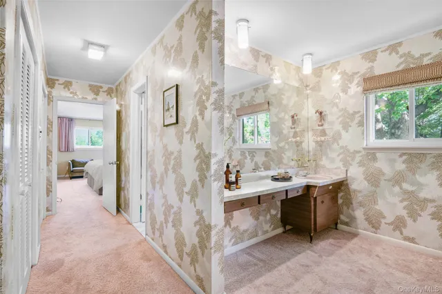 a bedroom with a bed a couch and a window