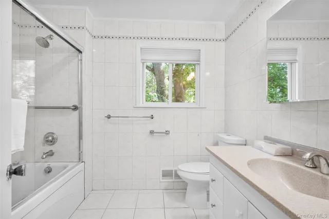 a bathroom with a sink a mirror and a shower