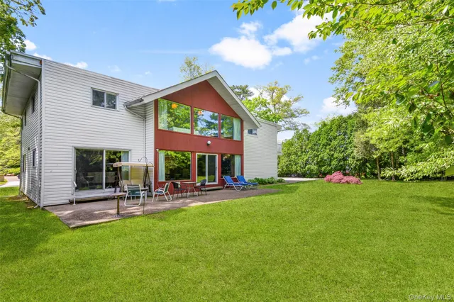 a room with pool table and windows