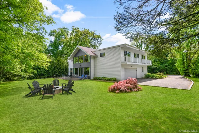 a view of a patio with a table and chairs under an umbrella