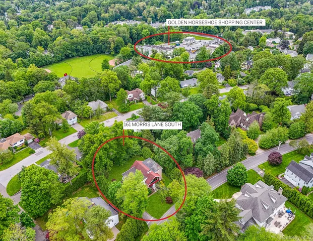 a front view of house with yard and outdoor seating