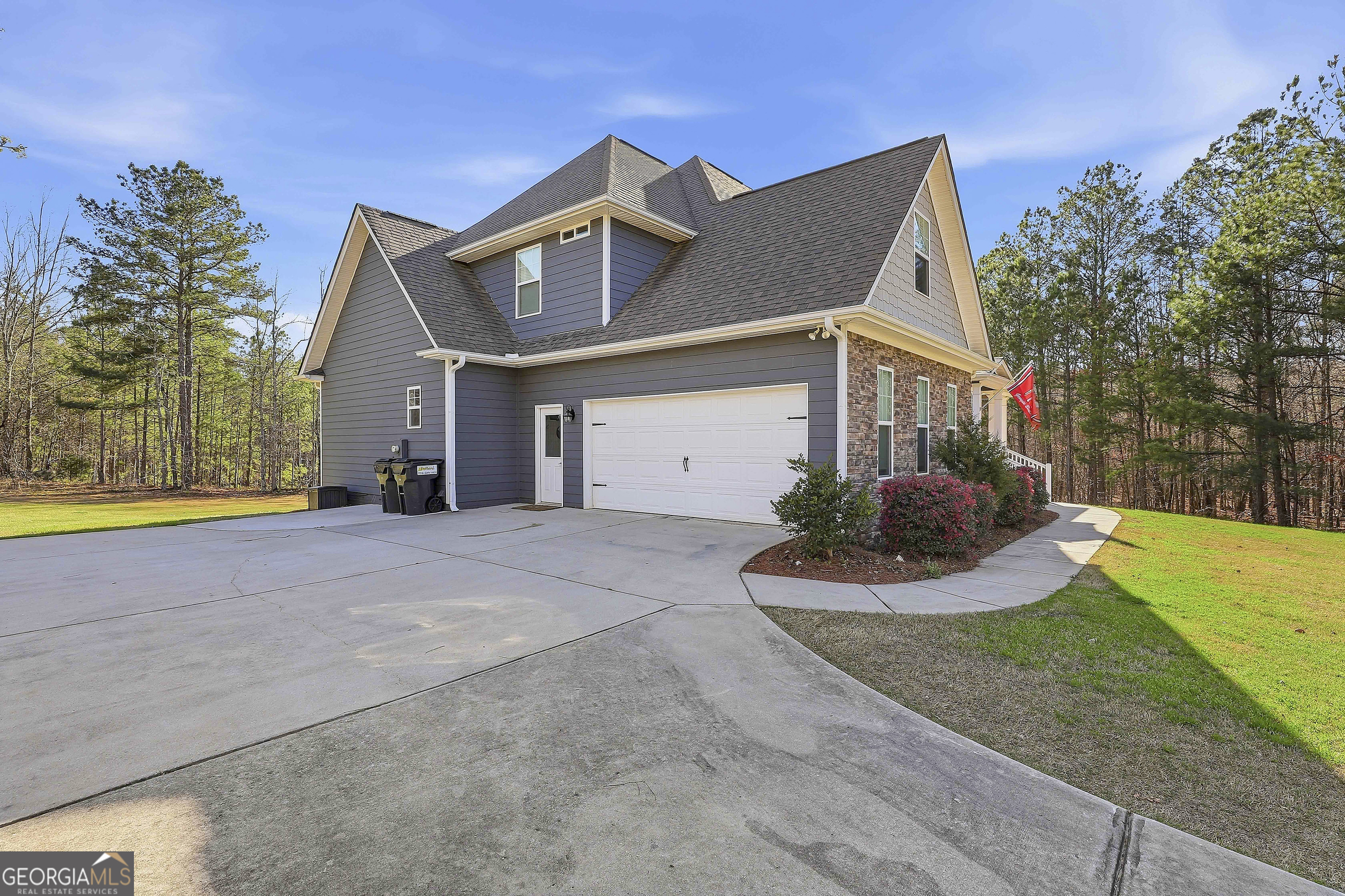 170 Emerson Ridge Trail Senoia, GA 30276 - Photo 3 of 24 a view of a house with a yard and potted plants