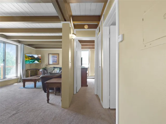 a living room with furniture and a gate