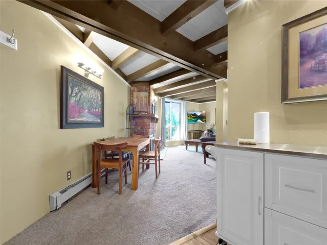a view of a livingroom with furniture and window