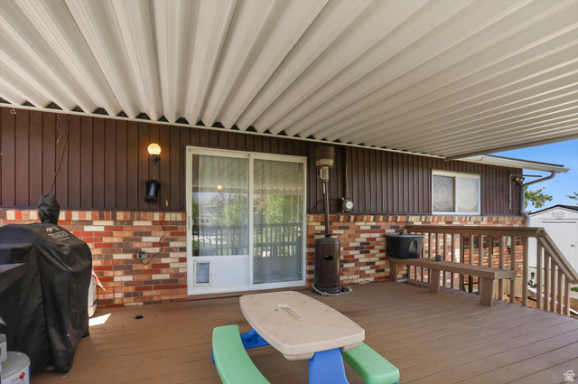 5108 South 2000th Street West Roy, UT 84067 - Photo 57 of 61 Porch featuring grilling area and a storage shed