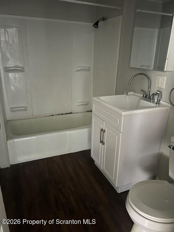 604 Depot Street, Unit 1 Scranton, PA 18509 - Photo 3 of 7 a bathroom with a sink a toilet a vanity and mirror