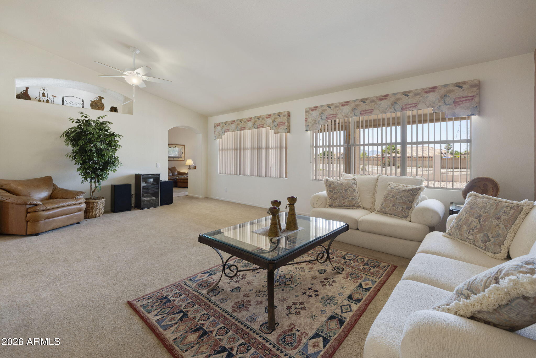 12435 West Monte Vista Road Avondale, AZ 85392 - Photo 12 of 69 a living room with furniture and a large window