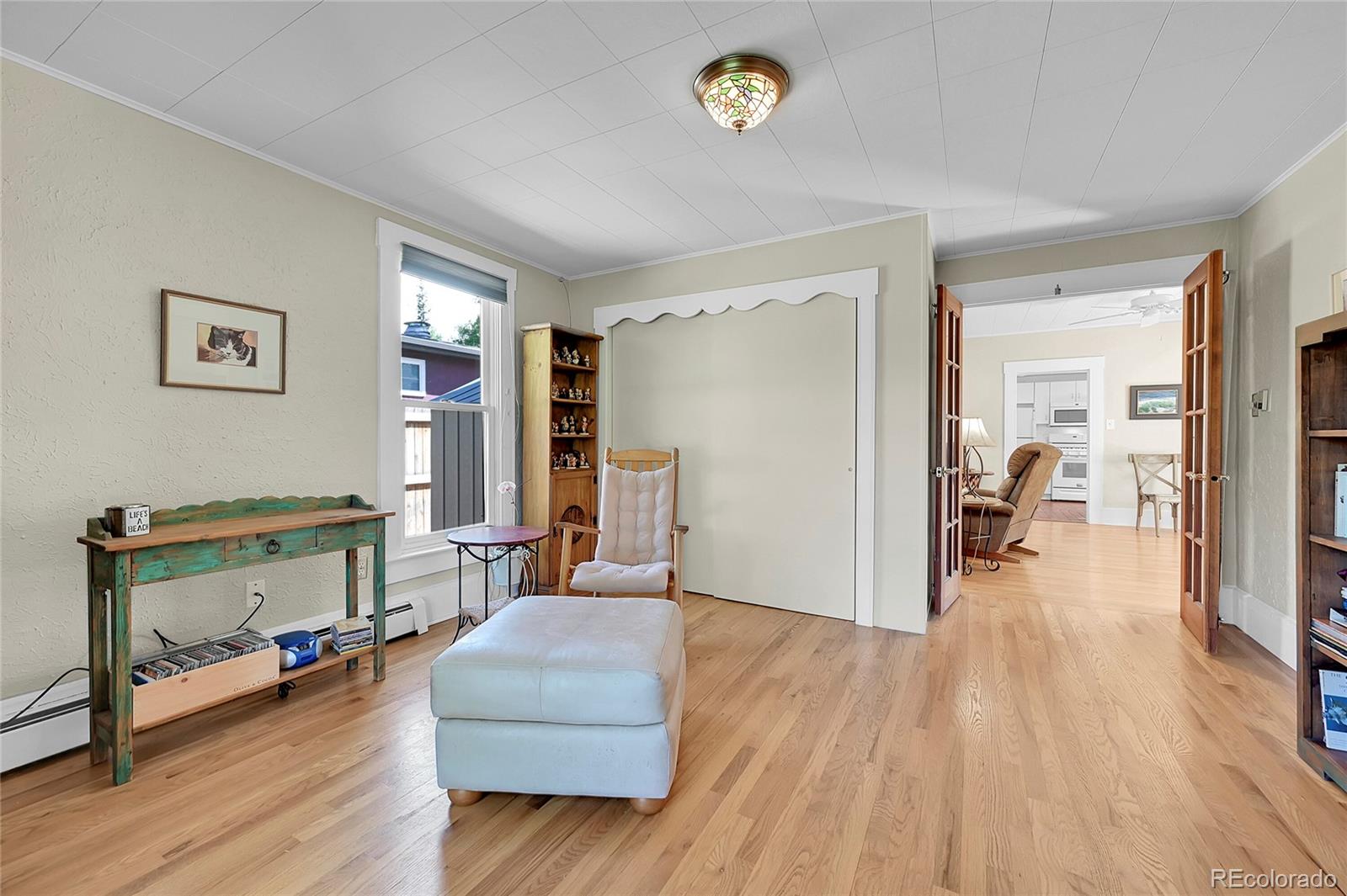 141 3rd Avenue Niwot, CO 80544 - Photo 11 of 49 a living room with furniture and a wooden floor