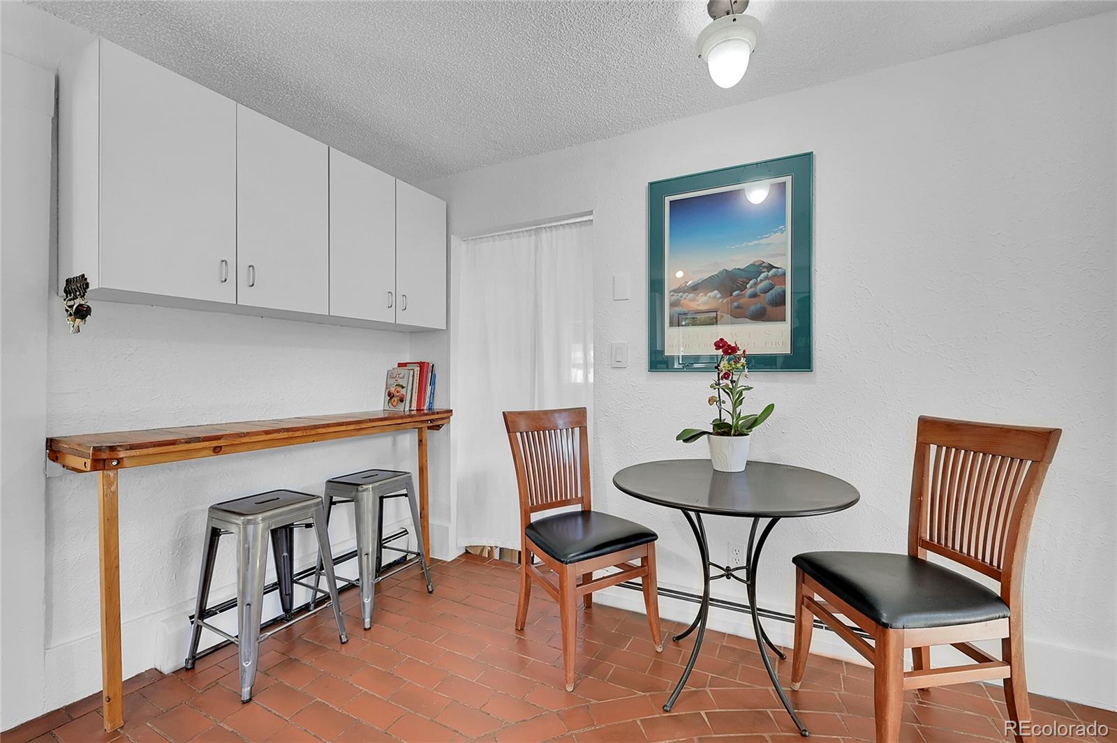141 3rd Avenue Niwot, CO 80544 - Photo 16 of 49 a kitchen with a dining table and chairs