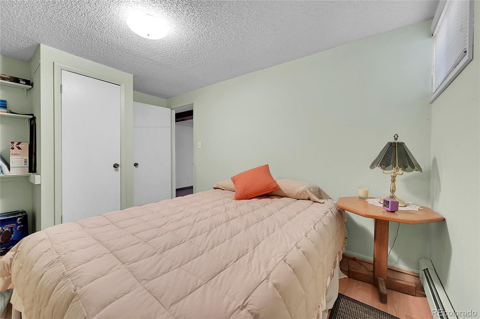 141 3rd Avenue Niwot, CO 80544 - Photo 29 of 49 a bedroom with a bed and a table