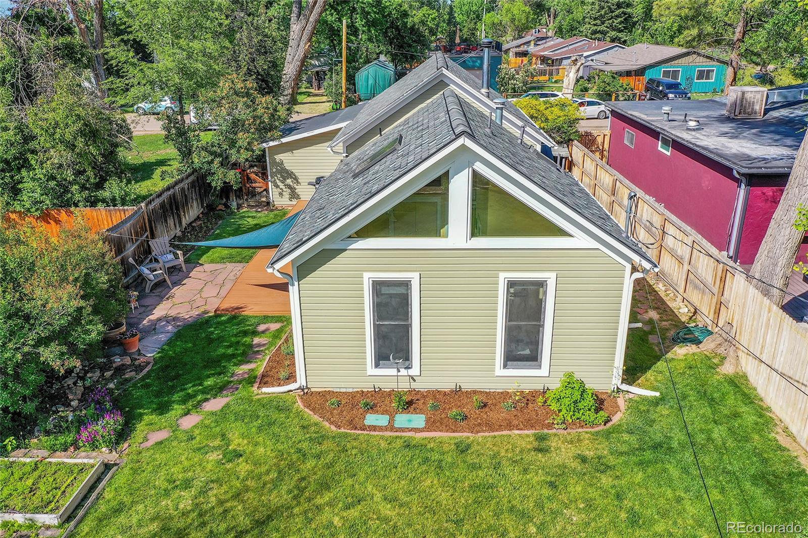 141 3rd Avenue Niwot, CO 80544 - Photo 36 of 49 a backyard of a house with lots of green space