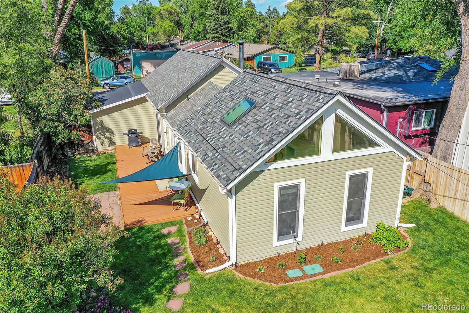 141 3rd Avenue Niwot, CO 80544 - Photo 37 of 49 aerial view of a house with a yard and potted plants