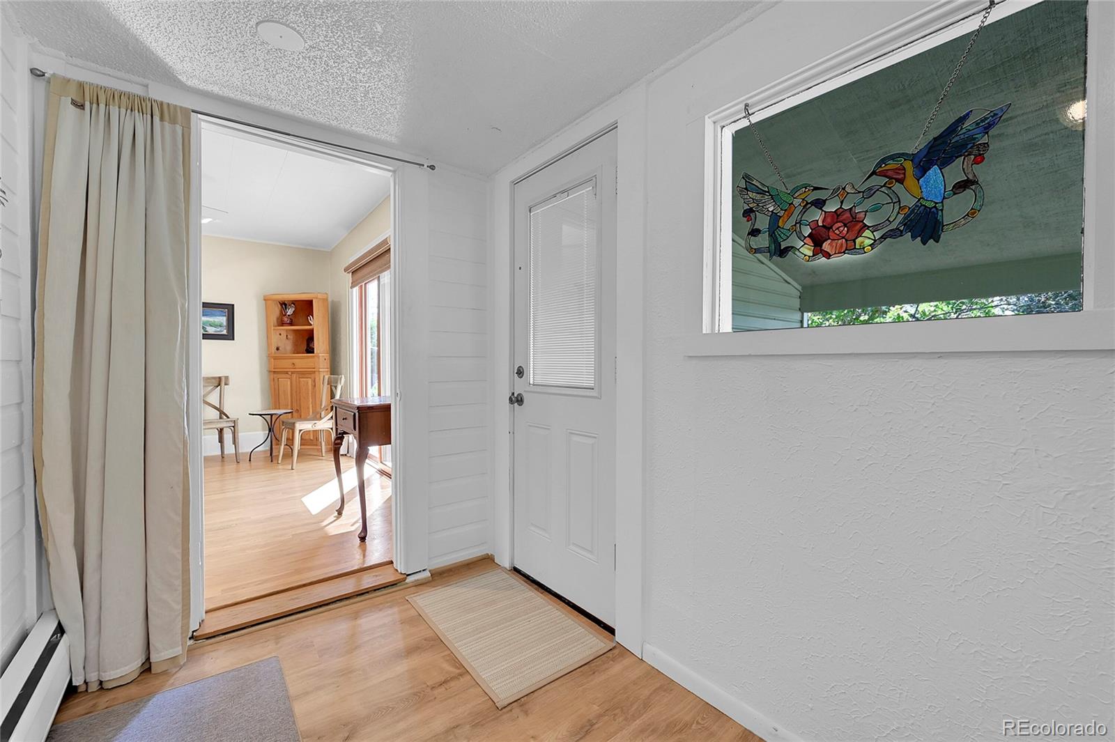 141 3rd Avenue Niwot, CO 80544 - Photo 9 of 49 a view of a hallway view with painting on the wall
