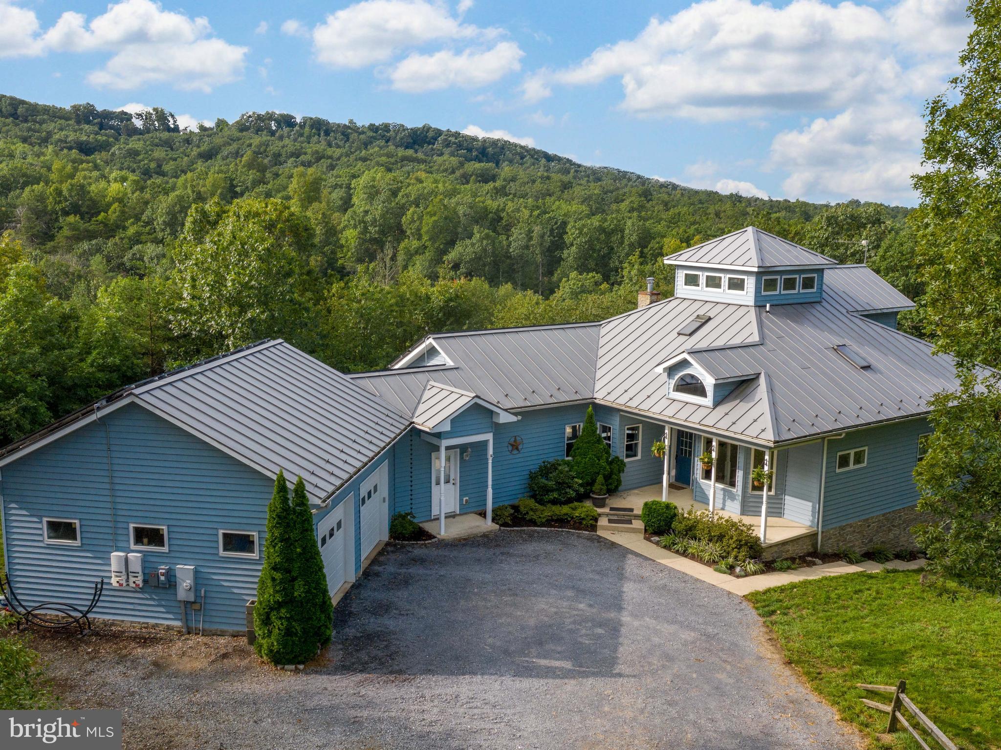 Stunning metal roof caps the house