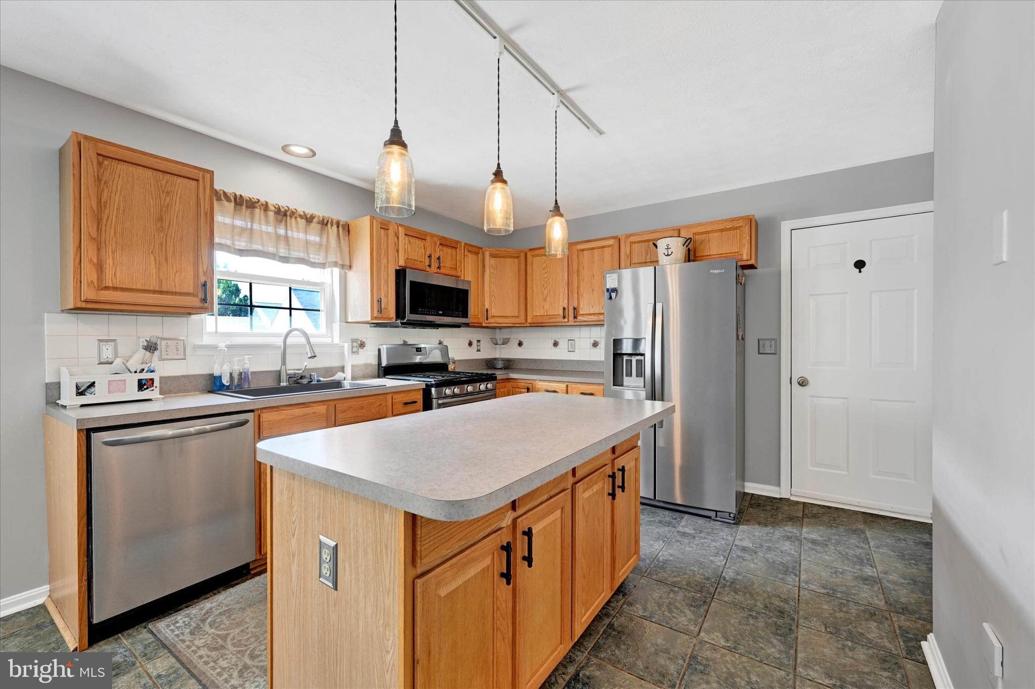 4195 Fallow Drive Hampstead, MD 21074 - Photo 14 of 40 a kitchen with a refrigerator a sink and a stove