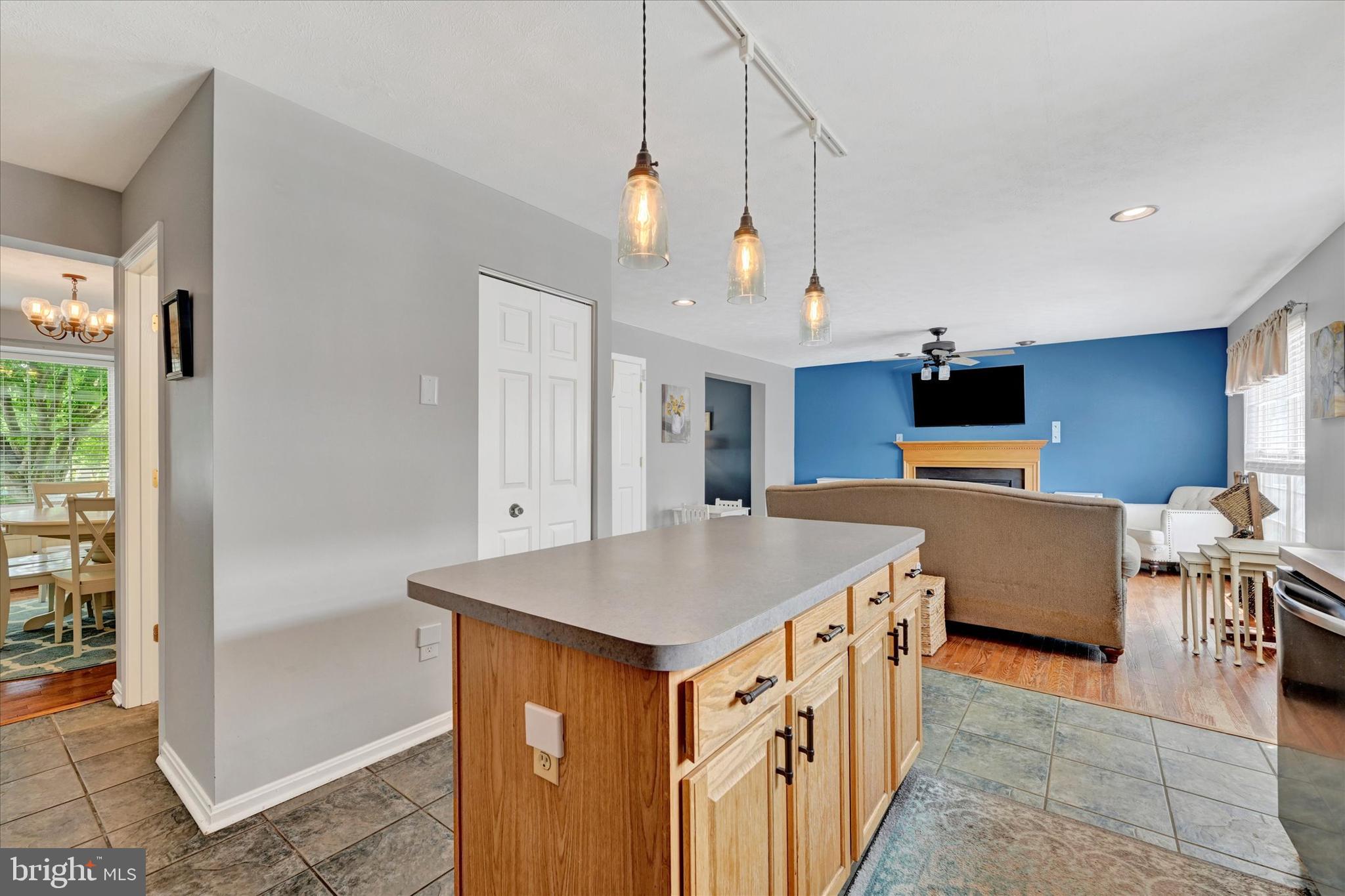 4195 Fallow Drive Hampstead, MD 21074 - Photo 16 of 40 a kitchen with a stove a refrigerator and a dining table