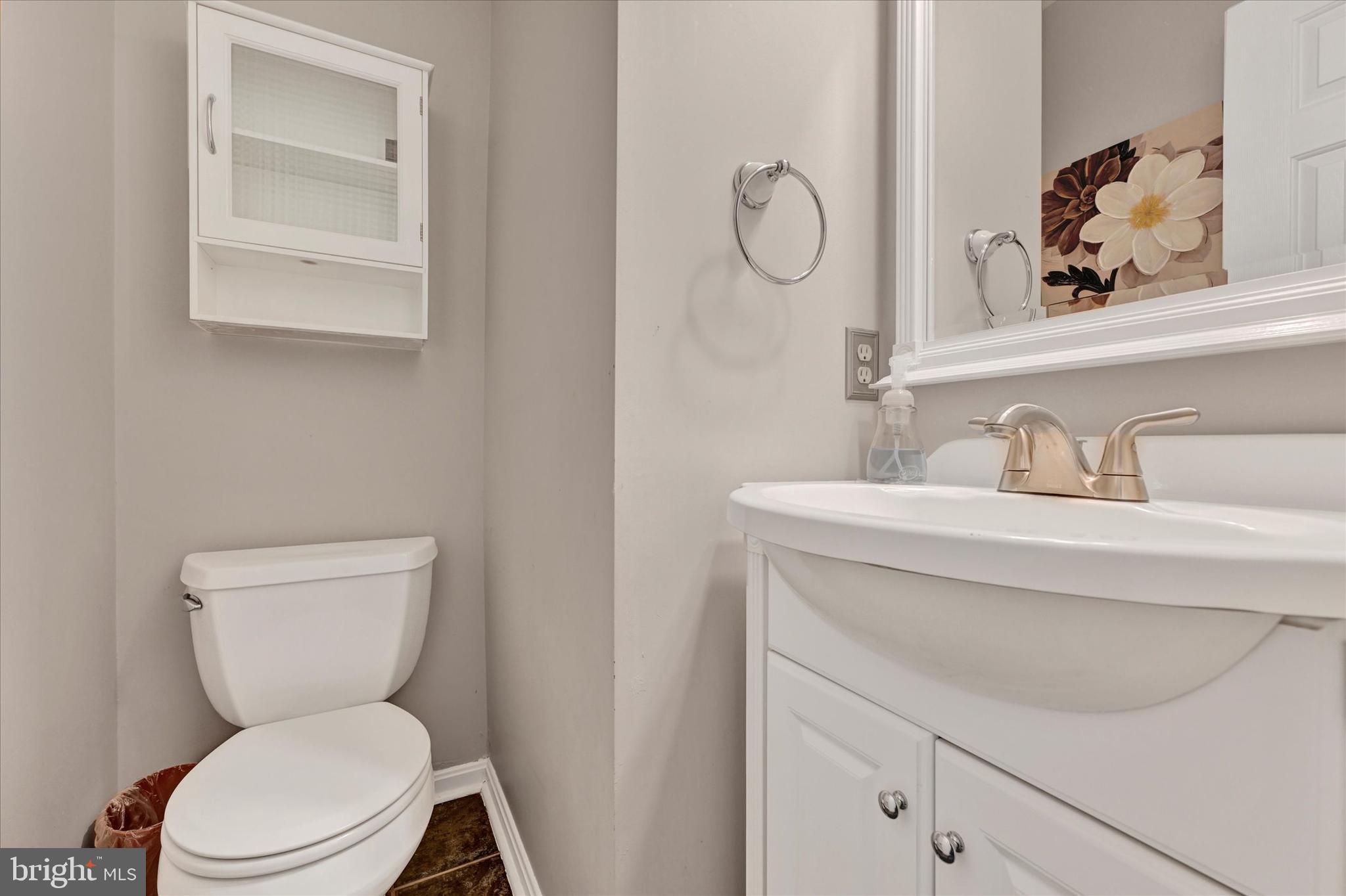 4195 Fallow Drive Hampstead, MD 21074 - Photo 17 of 40 a bathroom with a toilet sink and mirror