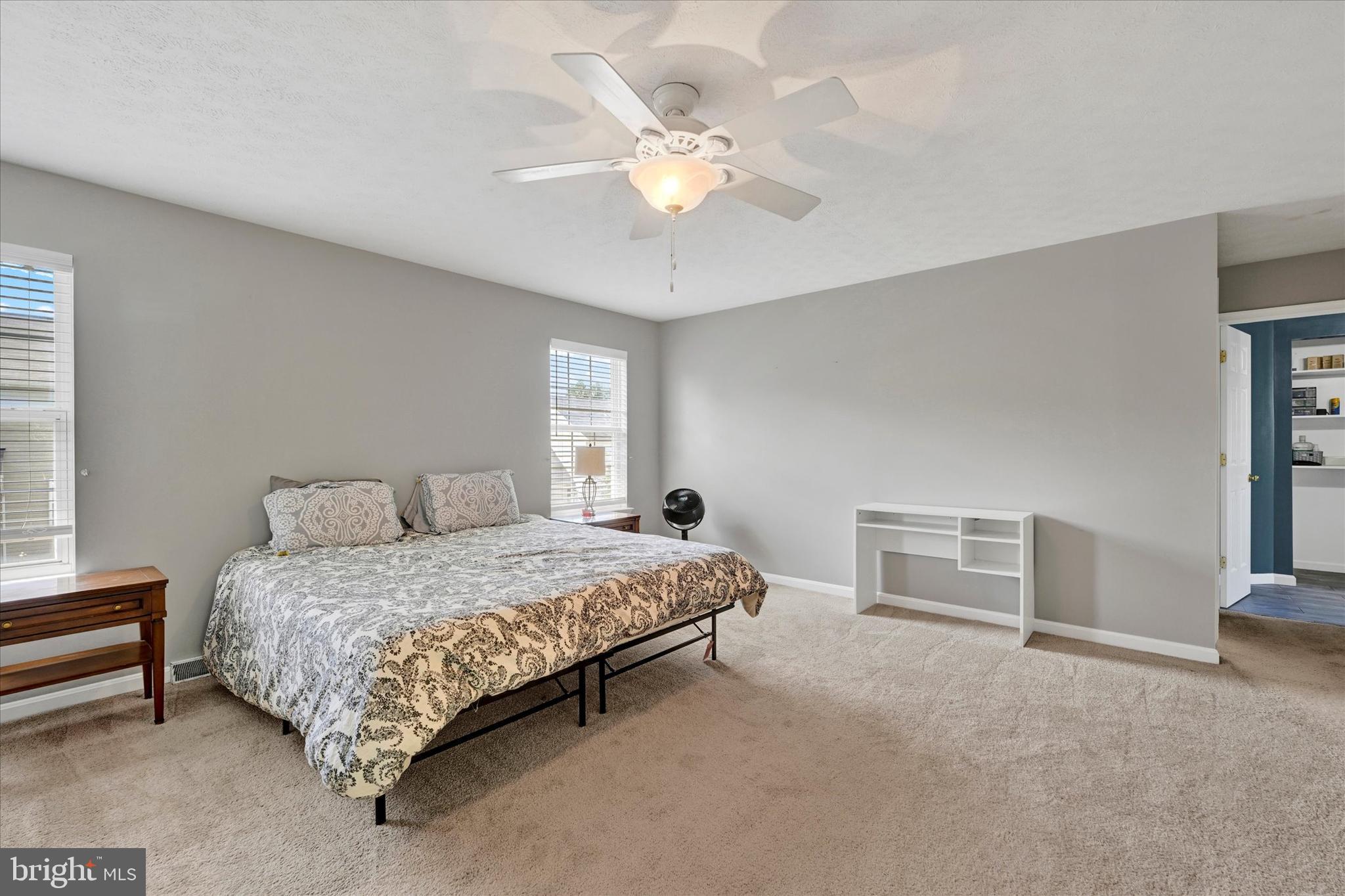 4195 Fallow Drive Hampstead, MD 21074 - Photo 19 of 40 a bedroom with a bed and a chandelier
