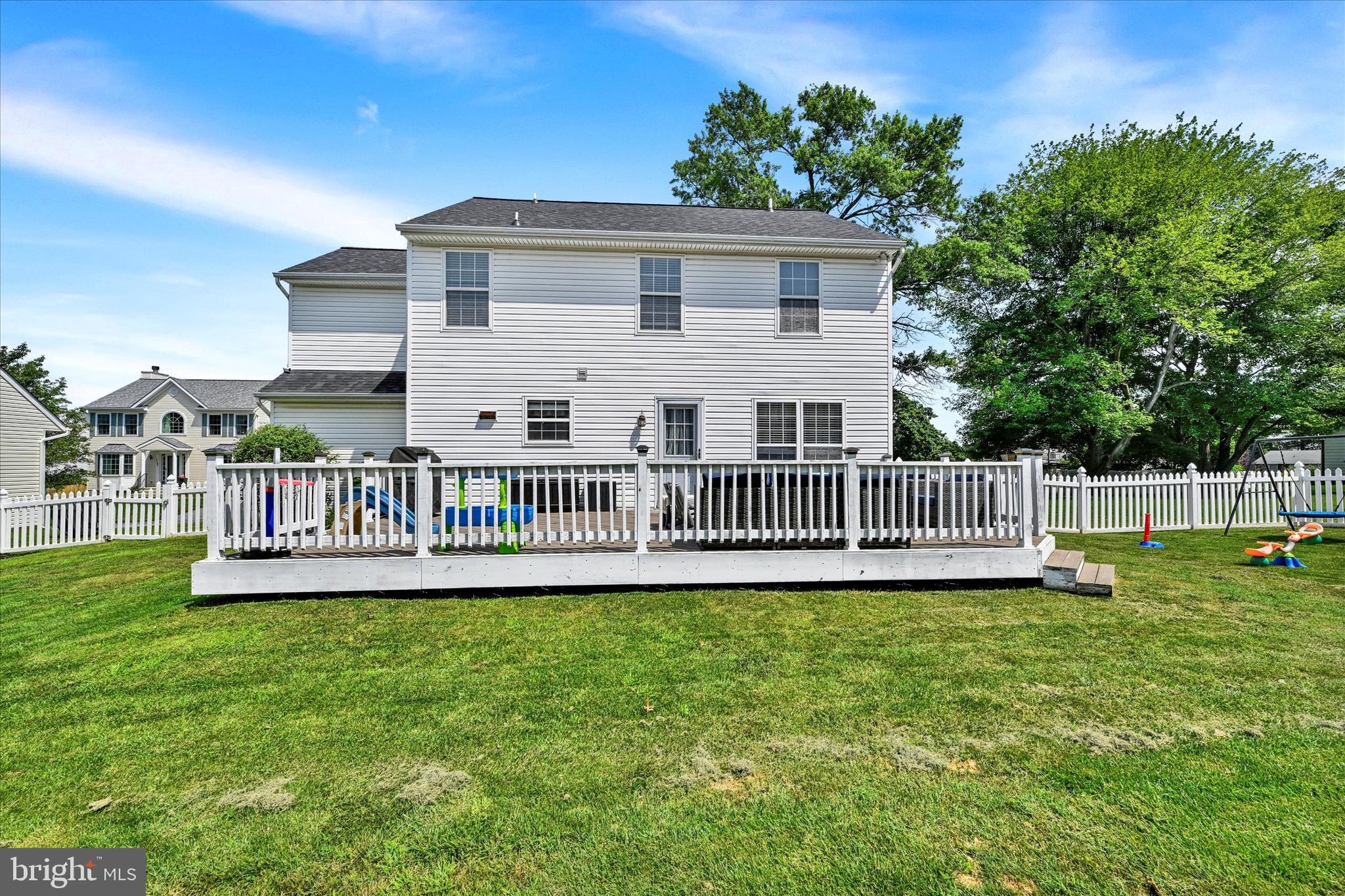 4195 Fallow Drive Hampstead, MD 21074 - Photo 28 of 40 a view of a house with a yard and deck