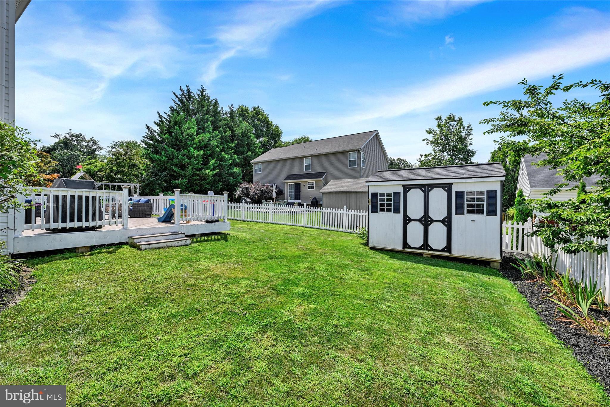 4195 Fallow Drive Hampstead, MD 21074 - Photo 30 of 40 a view of a house with a yard and deck