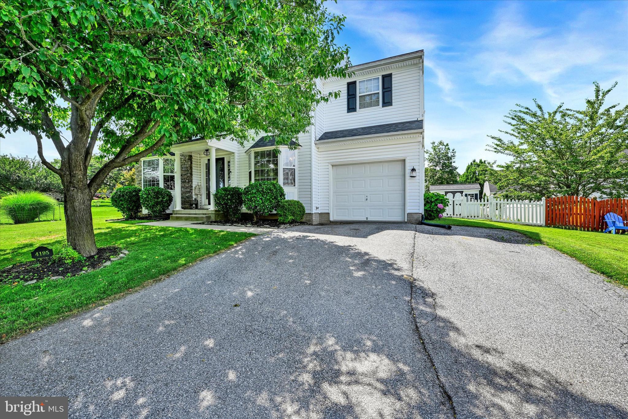 4195 Fallow Drive Hampstead, MD 21074 - Photo 3 of 40 a front view of a house with a yard and a garage