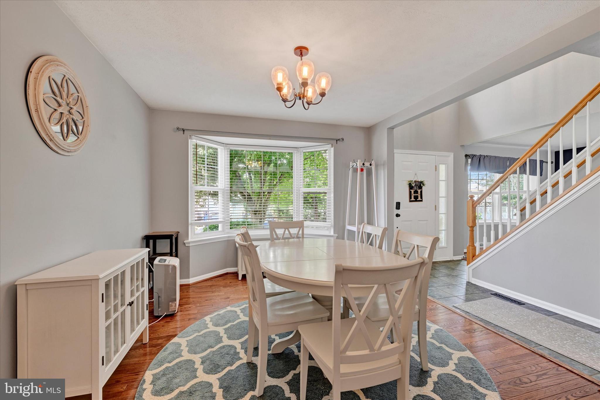 4195 Fallow Drive Hampstead, MD 21074 - Photo 6 of 40 a view of a dining room with furniture a chandelier and a window