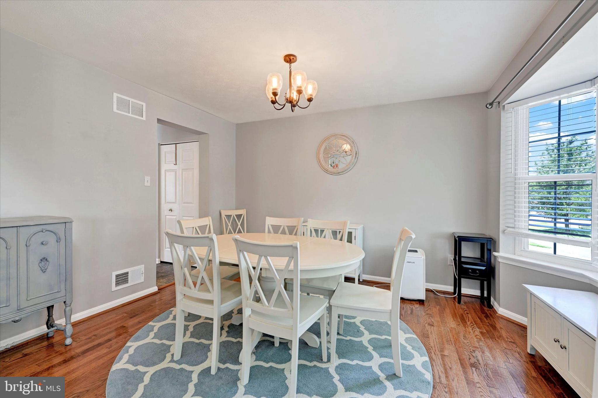 4195 Fallow Drive Hampstead, MD 21074 - Photo 7 of 40 a view of a dining room with furniture window and wooden floor