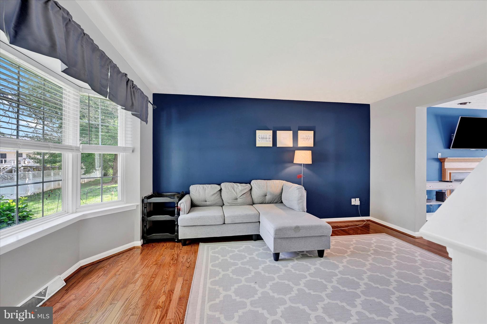 4195 Fallow Drive Hampstead, MD 21074 - Photo 8 of 40 a living room with furniture and a flat screen tv