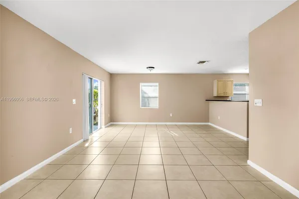 a view of an empty room and window