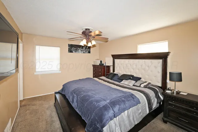 a bedroom with bed and window