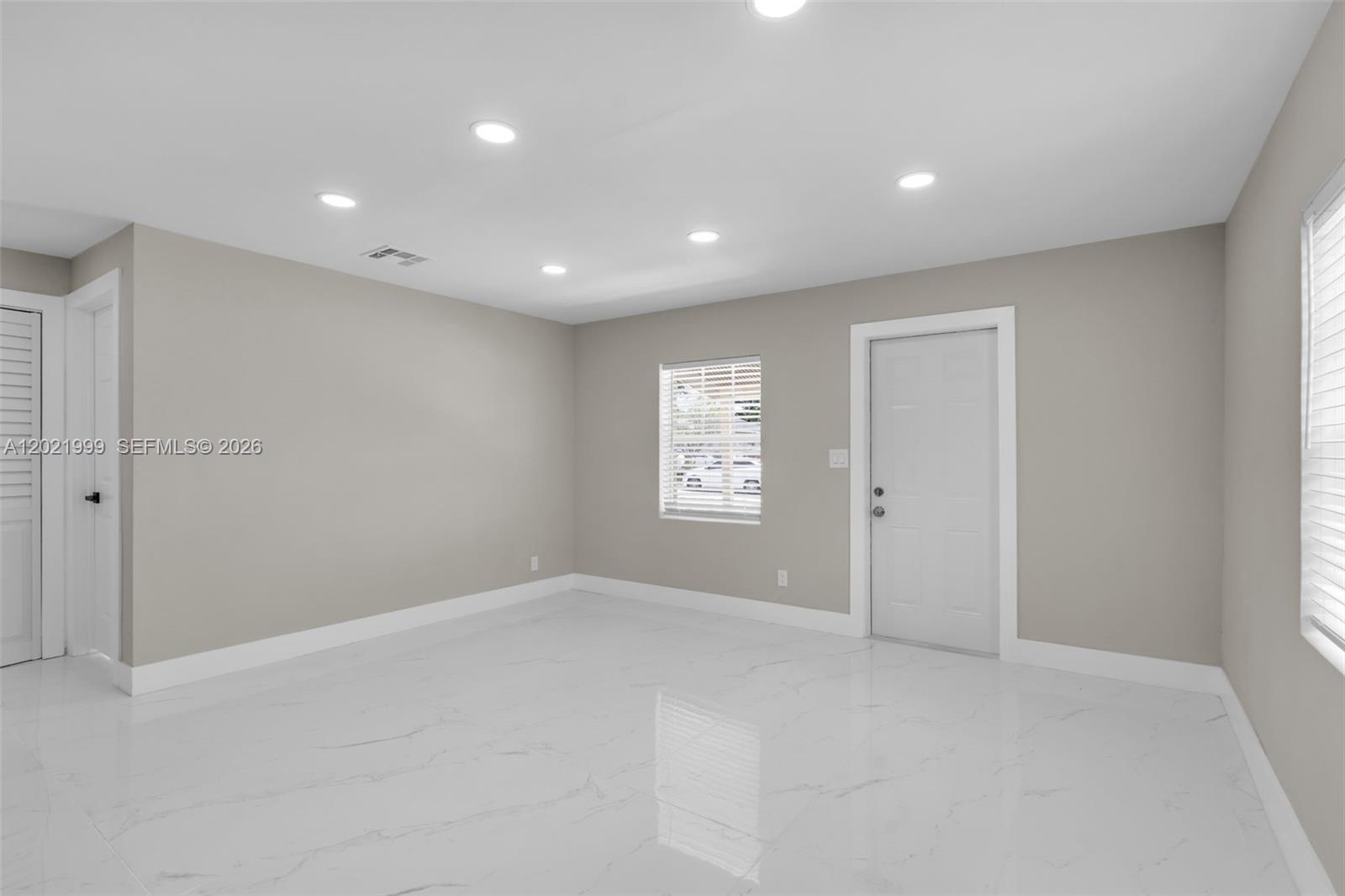 1660 West 26th Street Riviera Beach, FL 33404 - Photo 6 of 28 a view of an empty room
