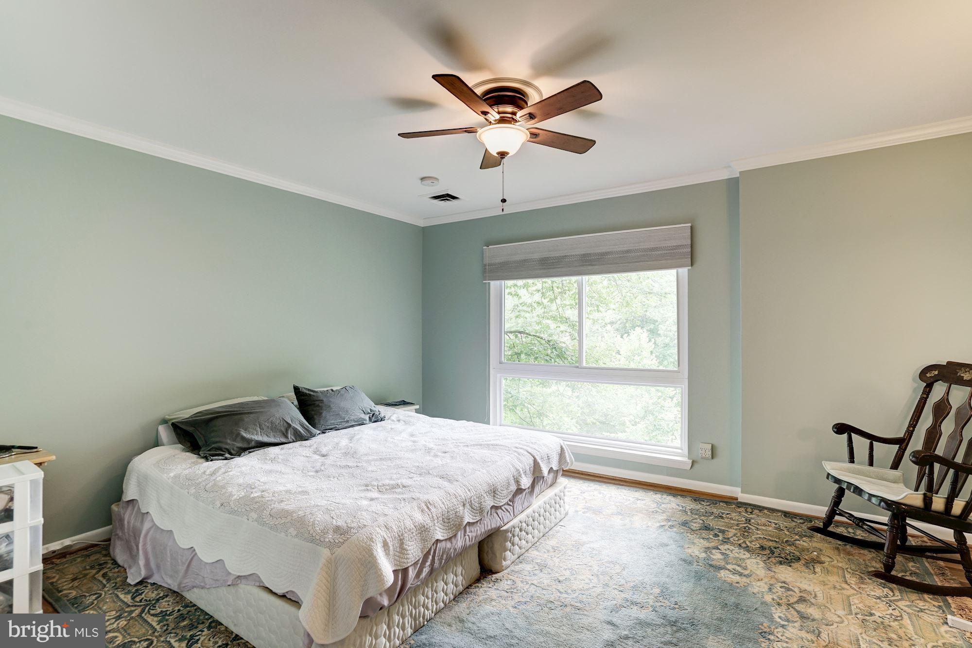 11089 Saffold Way Reston, VA 20190 - Photo 14 of 30 a bedroom with a bed and window