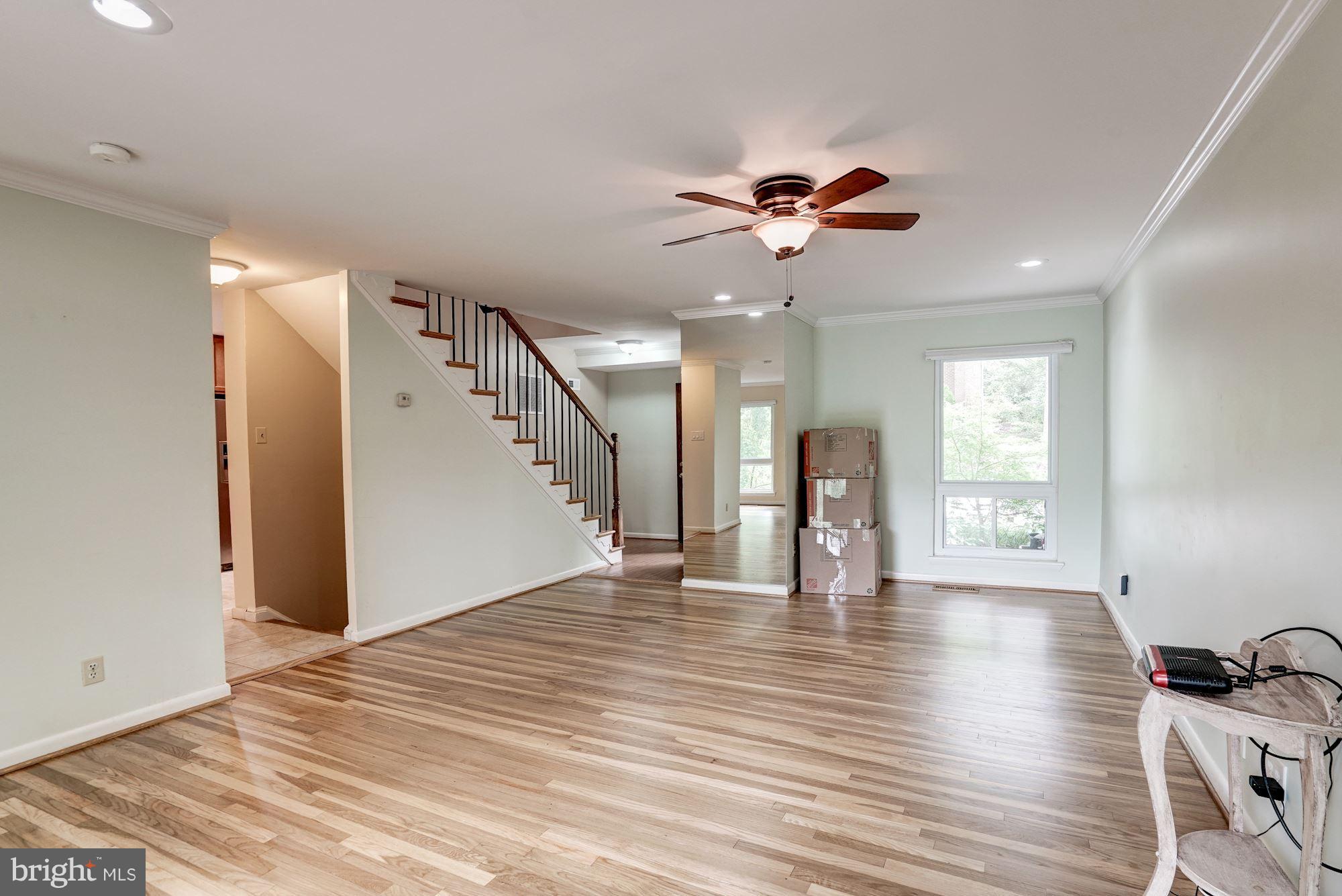 11089 Saffold Way Reston, VA 20190 - Photo 3 of 30 a view of an empty room with window and wooden floor
